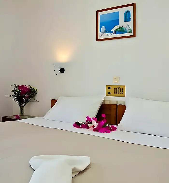 Bright bedroom with white linen