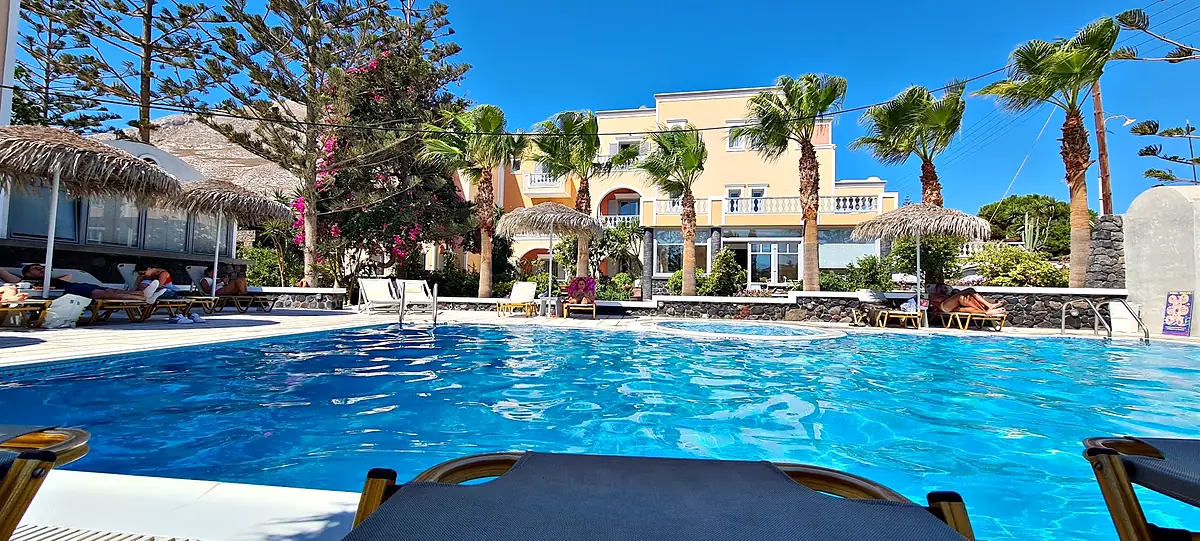 Castro Hotel pool with palms and umbrellas